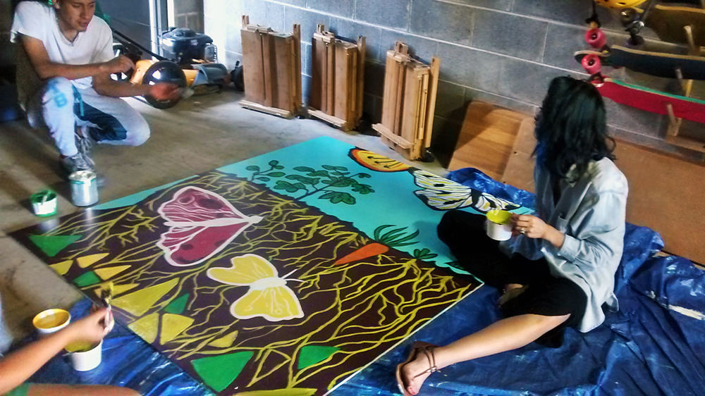 Kids Painting Butterflies for Migration Mural