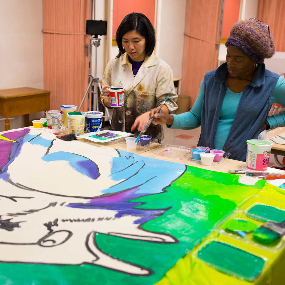 Artists Painting Mural about Unity and Community